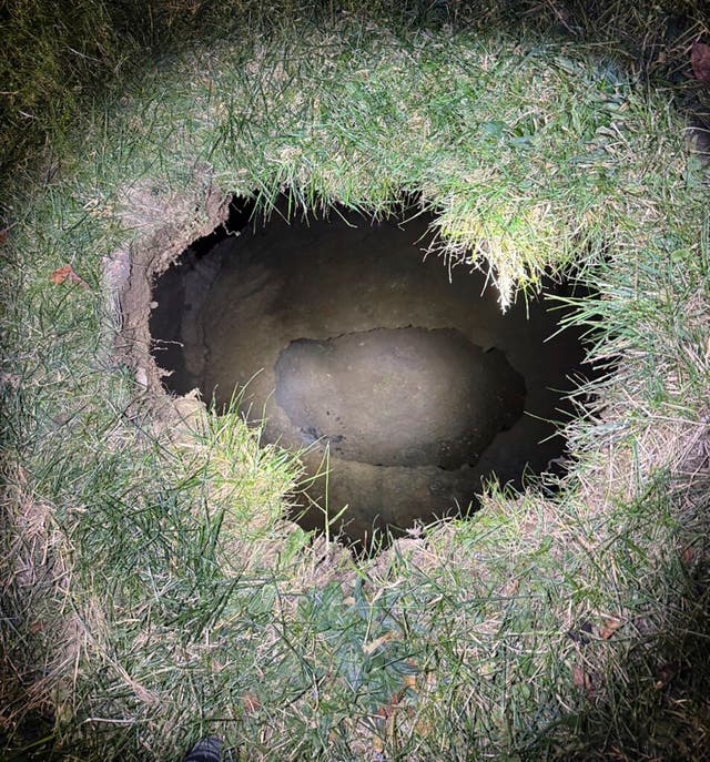 <p>This Tuesday, Dec. 3, 2024. image provided by the Pennsylvania State Police shows the top of a sinkhole in the village of Marguerite, Pa., where rescuers were searching for a woman who disappeared</p>