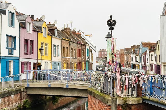 <p>The colourful architecture on Rue d'Engoulvent in Amiens</p>