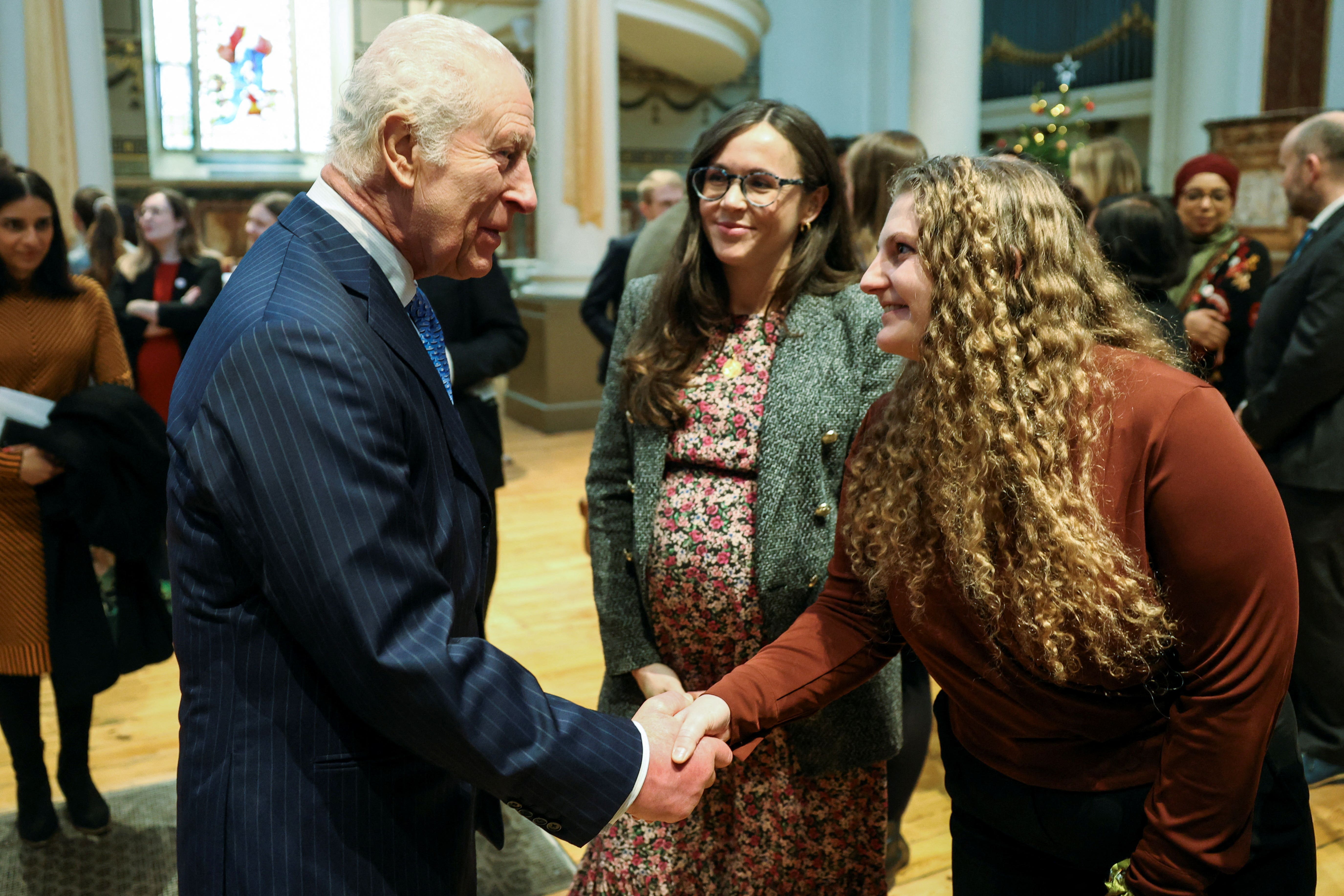 Charles with guests during a visit to St Peter’s Church in Notting Hill, London, to meet and thank DEC staff, aid workers and volunteers (Mina Kim/PA)