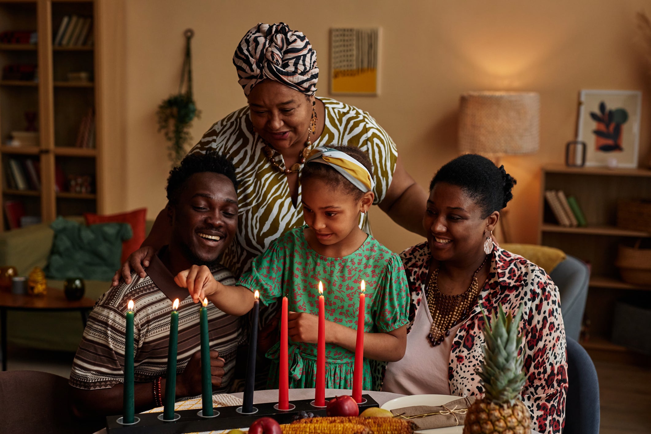 Families will light a Kinara — a candle holder that holds seven candles — for Kwanzaa