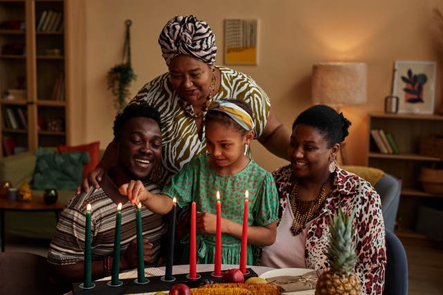 <p>Families will light a Kinara — a candle holder that holds seven candles — for Kwanzaa </p>