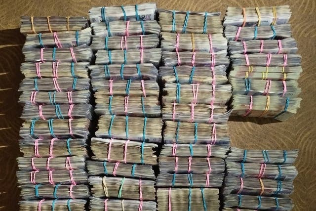 <p>Money seized from a cash courier when he was stopped on the M5 near Birmingham</p>