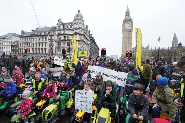 Children on toy tractors during a farmers’ protest in central London over the changes to inheritance tax rules (Gareth Fuller/PA)