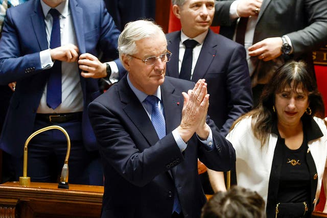 <p>Michel Barnier gestures to the National Assembly after MPs voted against his government</p>