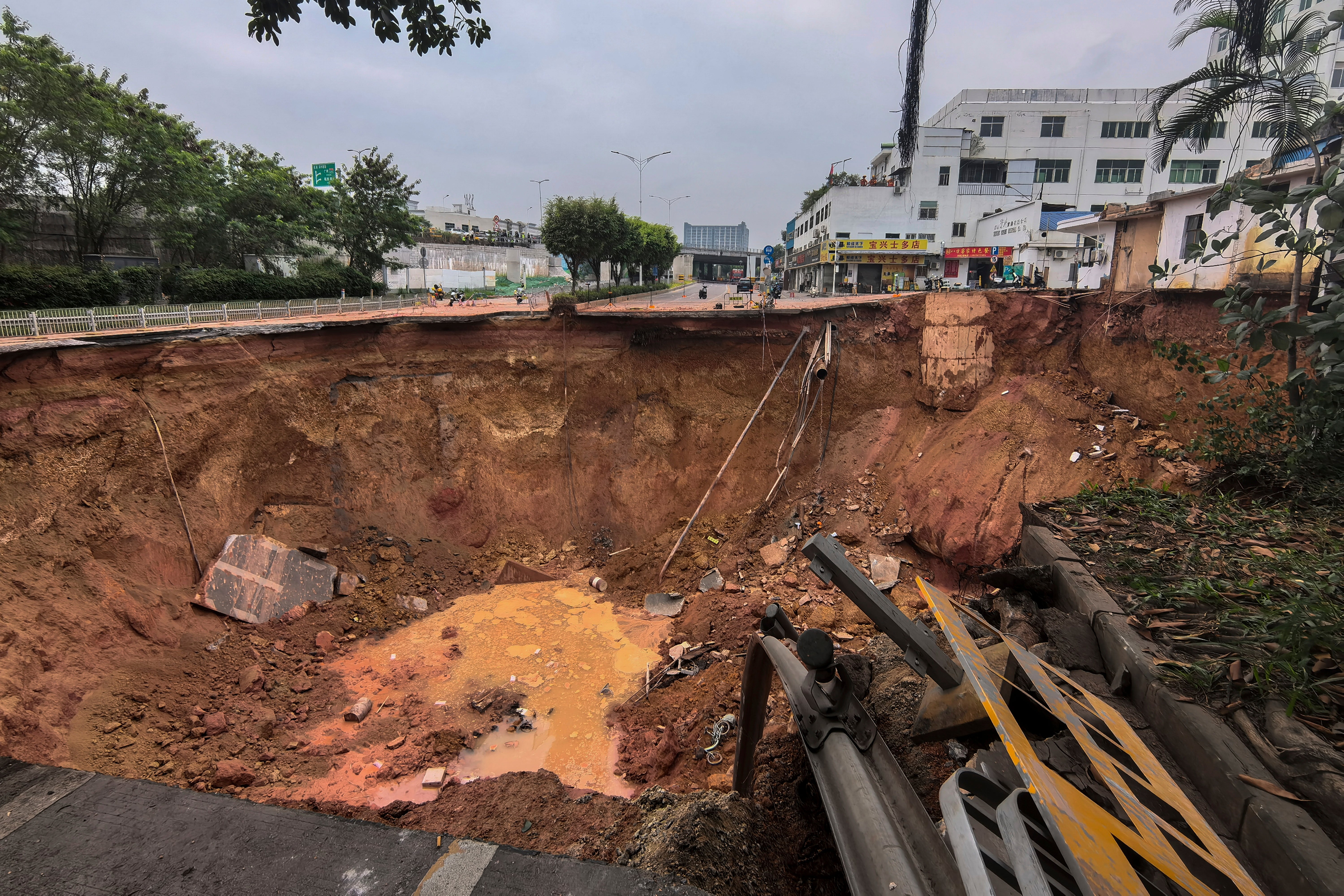 In this photo released by Xinhua News Agency, a collapsed ground is seen at a construction site on a section of the Shenzhen-Jiangmen Railway in Bao'an district in Shenzhen, south China’s Guangdong Province Thursday, 5 December 2024