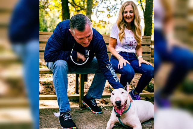 <p>‘Trooper’ the bull terrier with his new family </p>