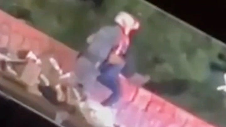 <p>Police officer throws delivery worker off bridge during traffic stop.</p>