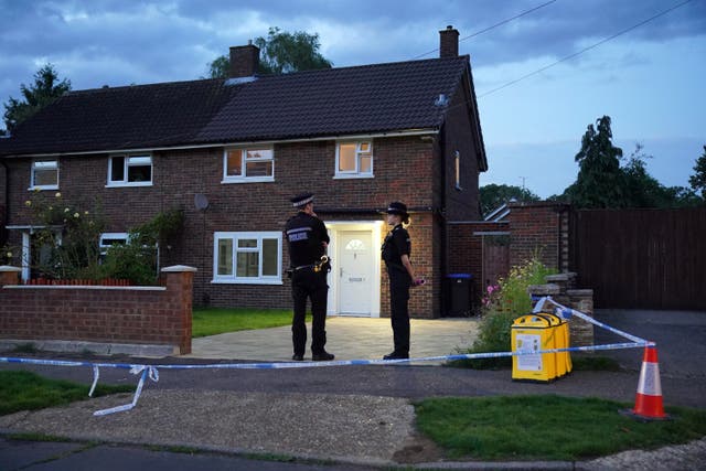 <p>Police officers stand outside Sharif’s house on Hammond Road in Woking on 10 August 2023</p>