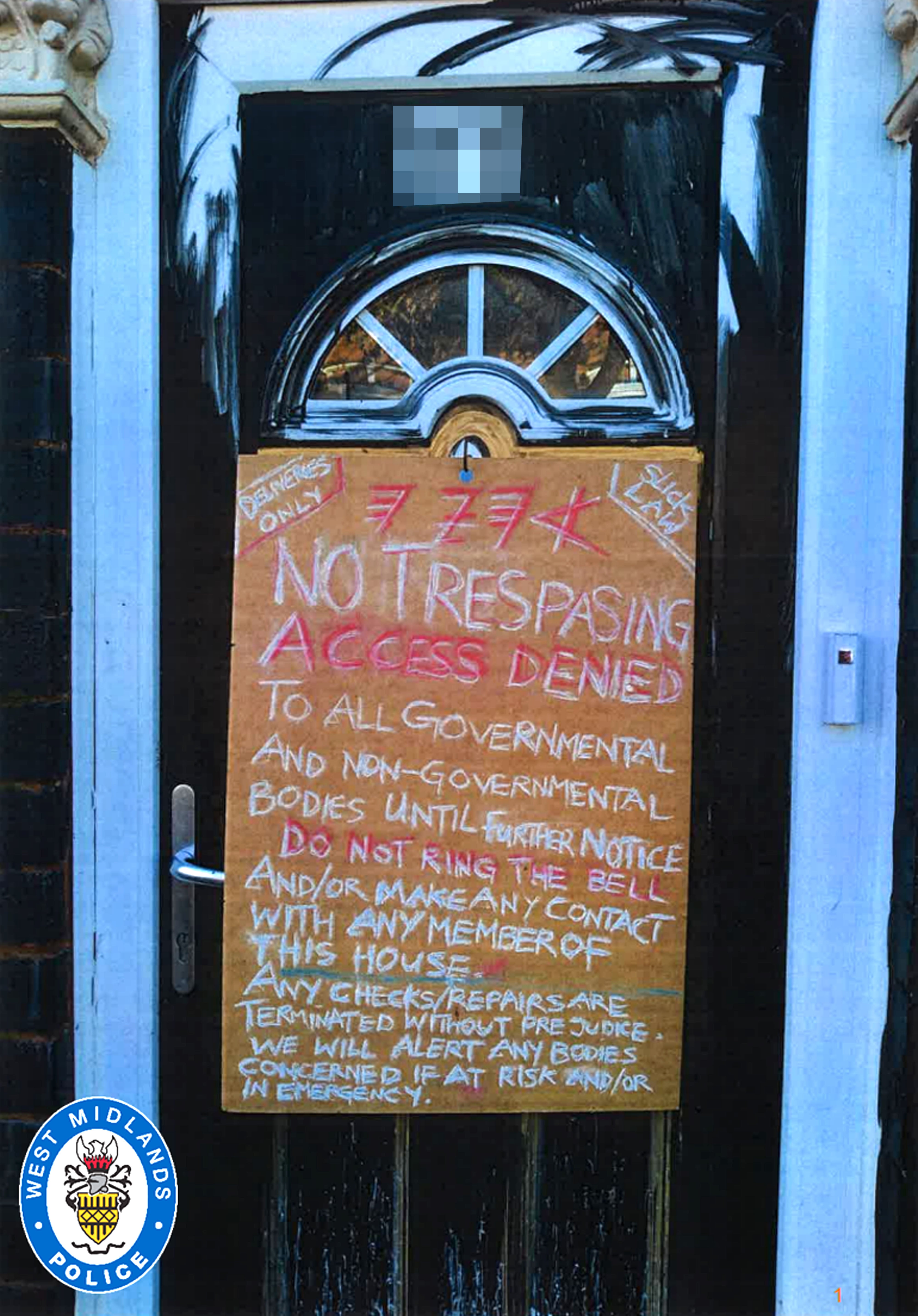 A sign on the front door of the couple’s home warning people to stay away