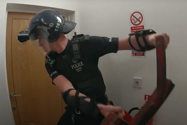 Screenshot of video footage showing police officers trying to enter Robert Jenner’s flat (Kent Police/PA)