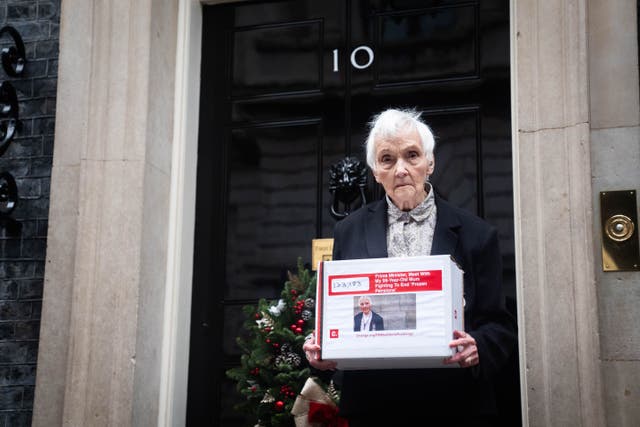 Anne Puckridge delivers a 133,000-strong petition to 10 Downing Street, London (James Manning/PA)