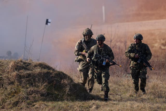 <p>Soldiers from the UK’s 2nd Battalion Royal Anglian infantry unit storm an enemy position in a simulated attack in Drawsko Pomorskie, Poland</p>