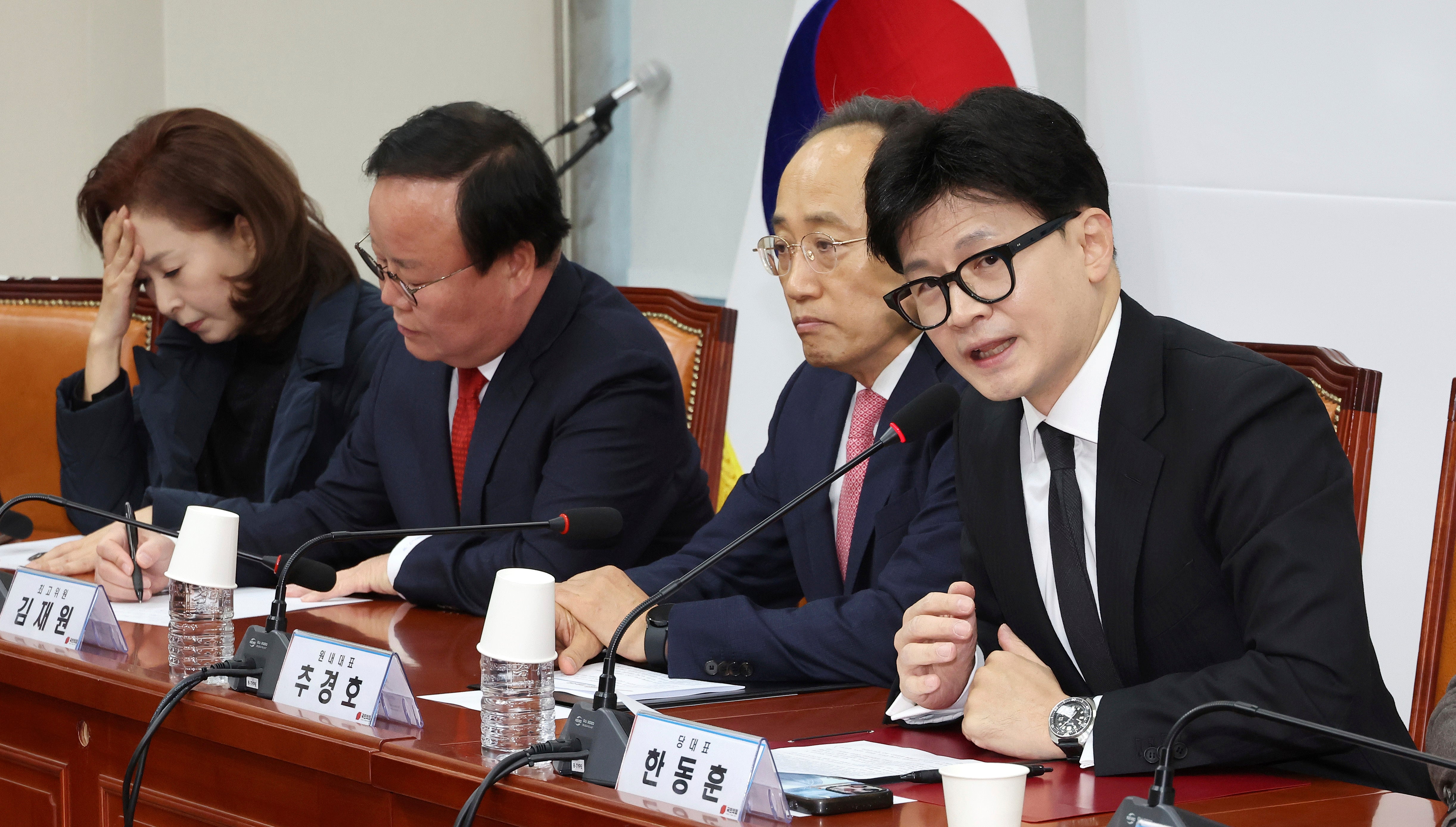 South Korea’s ruling People Power Party leader Han Dong Hun, right, speaks during a meeting of the party’s leadership at the National Assembly in Seoul, South Korea, Thursday, 5 December 2024