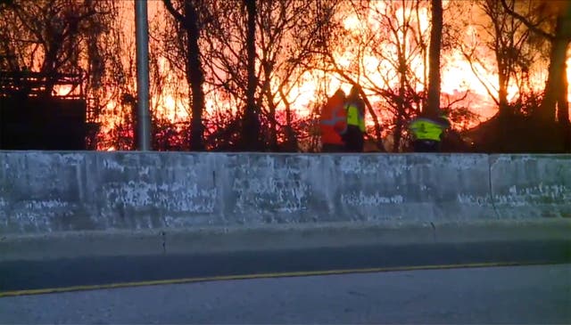 <p>Firefighters have contained a massive brush fire that led to road closures near Baltimore </p>