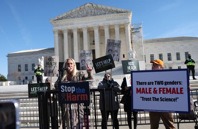 <p>U.S. Rep. Marjorie Taylor Greene (R-GA) speaks outside the U.S. Supreme Court during a rally as the high court hears arguments in a case on transgender health rights this week in Washington, DC</p>