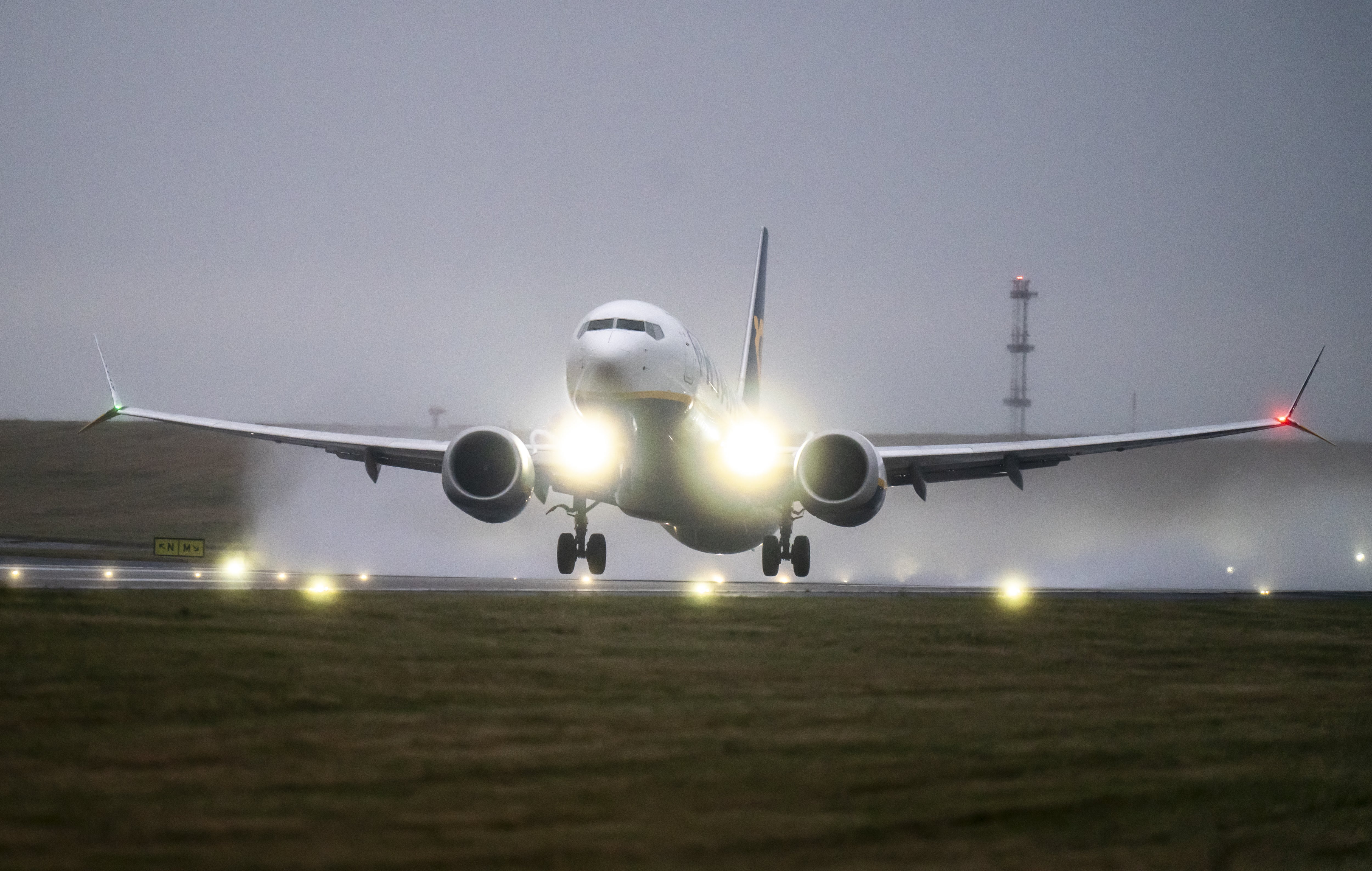 A plane takes off at Leeds Bradford Airport during Storm Darragh (Danny Lawson/PA)