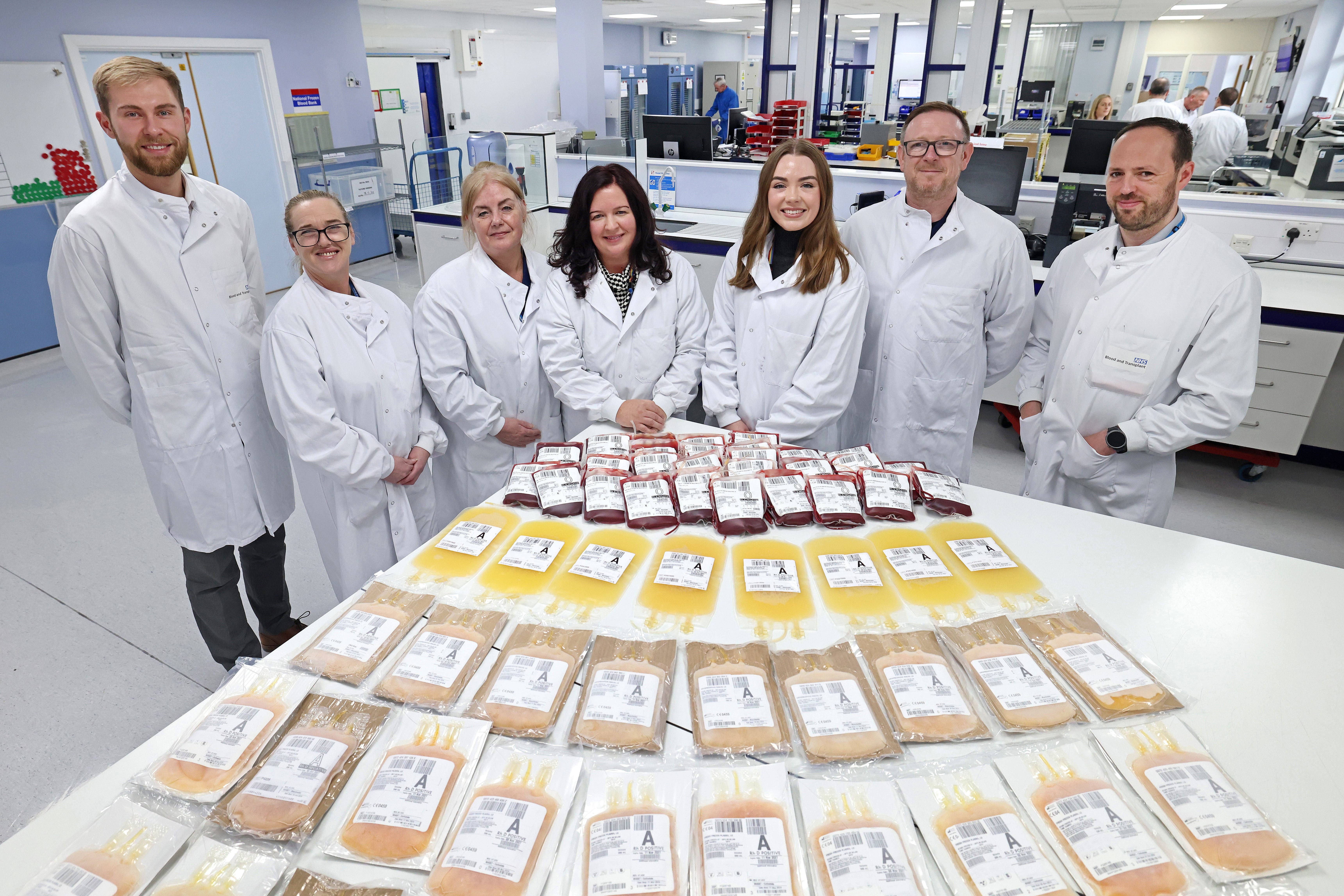 Adele Darlington, fourth left, with the NHS Blood Transplant team who helped save her life (NHS Blood Transplant/PA)