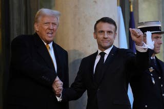 Trump and Macron greet each other in France on December 7 ahead of the re-opening of the Notre Dame Cathedral