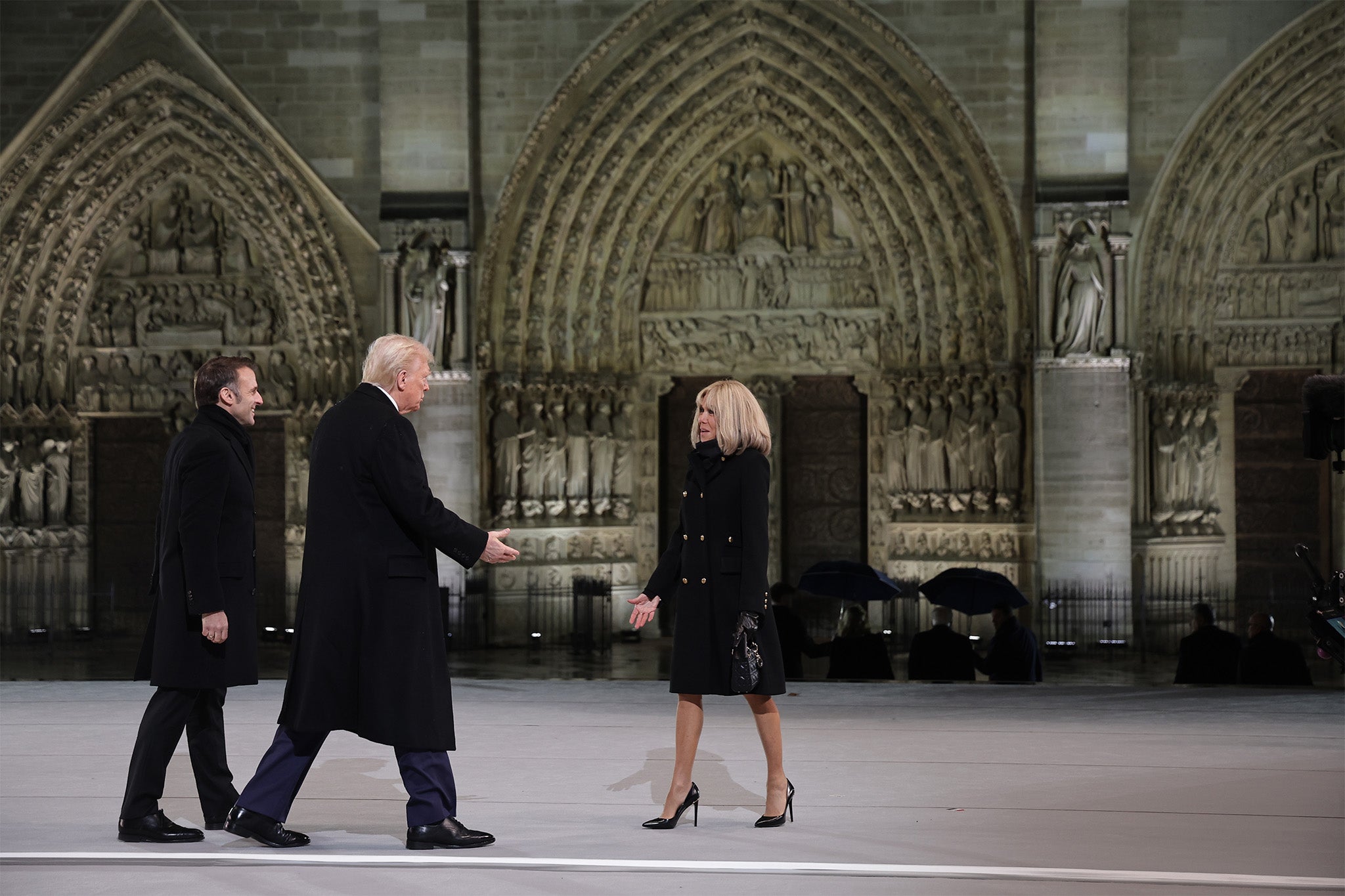 Emmanuel Macron and his wife Brigitte welcome Mr Trump for the reopening ceremony of the Notre Dame de Paris Cathedral, in Paris