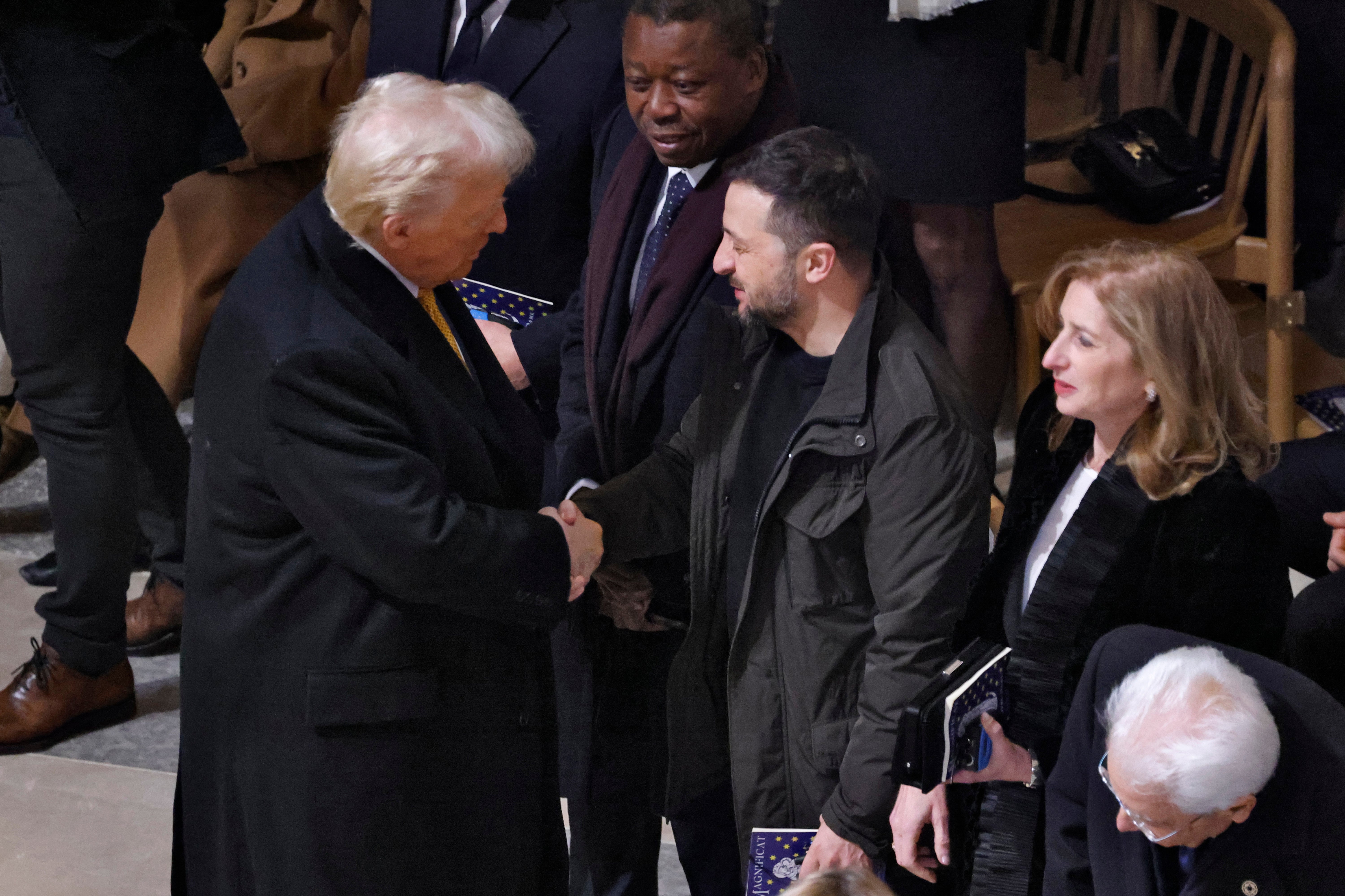 Donald Trump with Volodymyr Zelensky inside the reopened Notre Dame de Paris cathedral