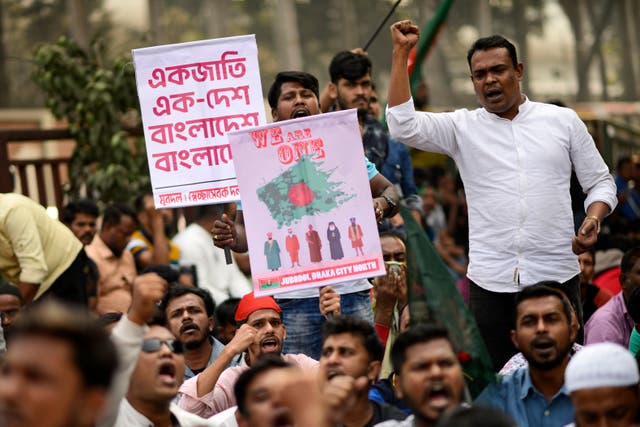<p>Supporters of Bangladesh's former prime minister Khaleda Zia shout slogans during a protest outside the Indian embassy in Dhaka on 8 December 2024</p>