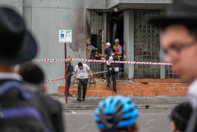 <p>Community members recover items from the Adass Israel synagogue</p>