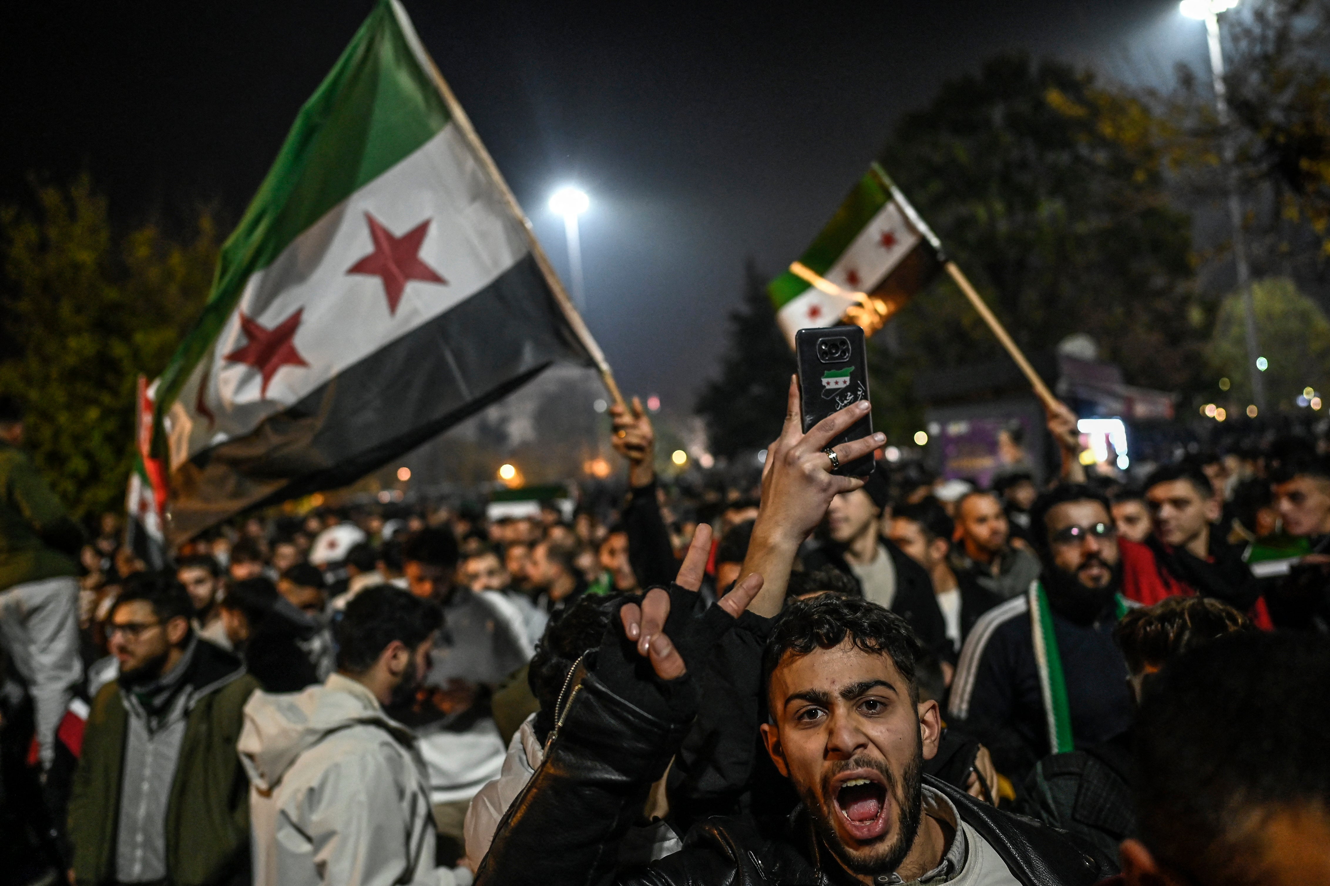 Syrian residents in Turkey celebrate following the fall of the Assad regime