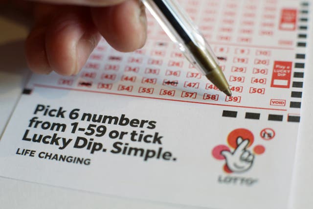 National Lottery group Allwyn has revealed lower sales and earnings (Yui Mok/PA)