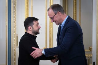 Ukrainian President Volodymyr Zelensky and German Chancellor Friedrich Merz Shat Hand Hand During the meeting in Kiev