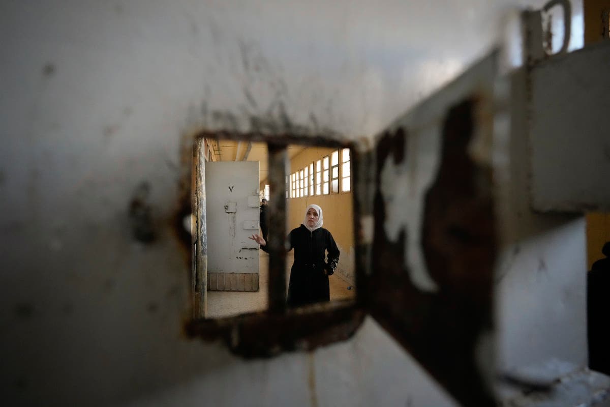 Thousands scour Syria’s most horrific prison but find no sign of their loved ones