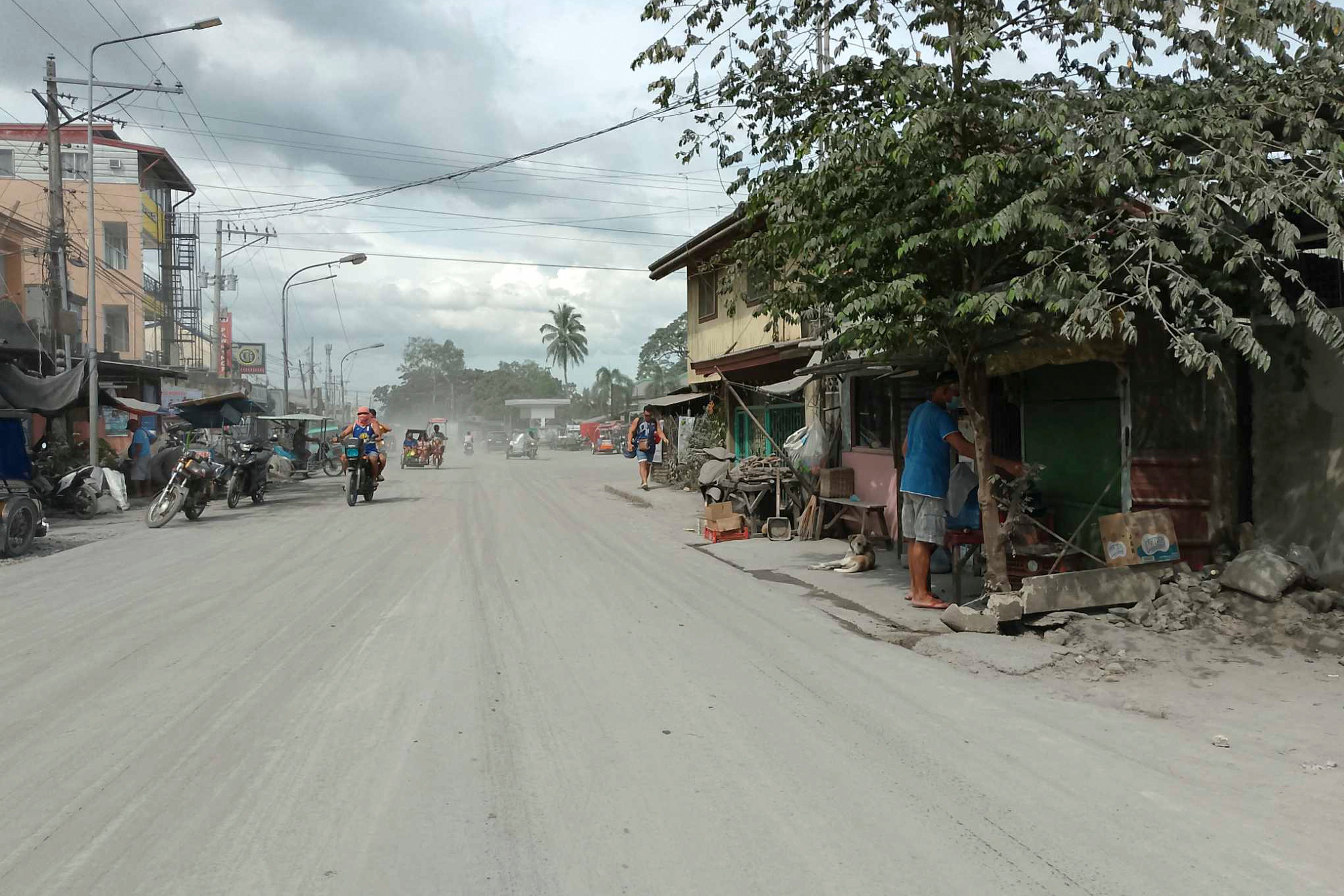 Volcanic ash covers a street in Bago city in the Negros Occidental province of the Philippines