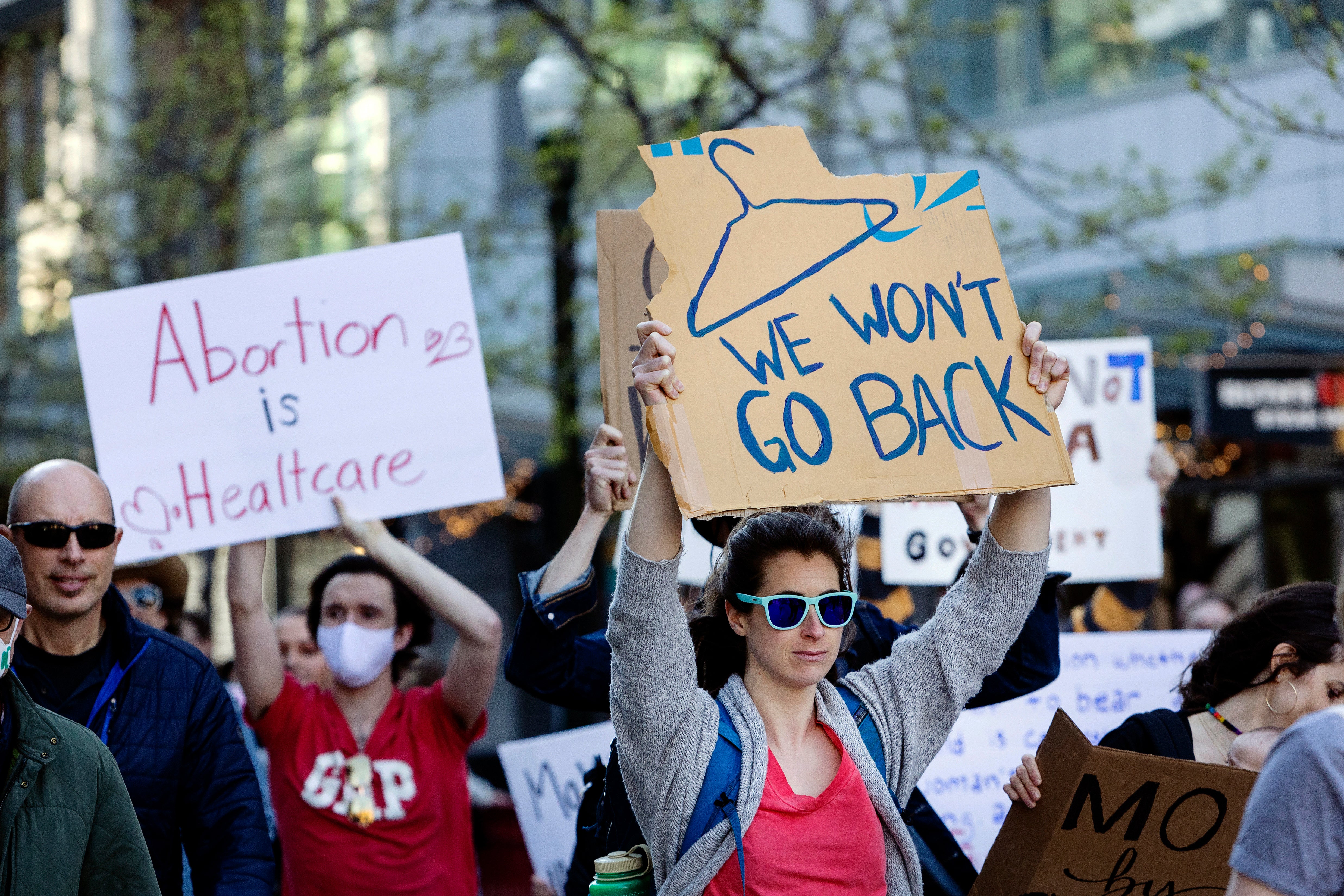 People march through 8th Street in downtown Boise, Idaho, on May 3, 2022, over state’s abortion ban