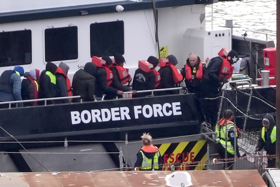 A group of people thought to be migrants are brought in to Dover, Kent, from a Border Force vessel following a small boat incident in the Channel (Gareth Fuller/PA)