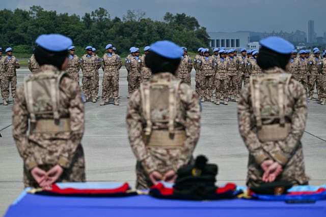 <p>File: Members of the Malaysian Armed Forces wearing blue berets stand to attention  during a dispatching ceremony at Subang Air Force Base near Kuala Lumpur on 6 November 2024</p>