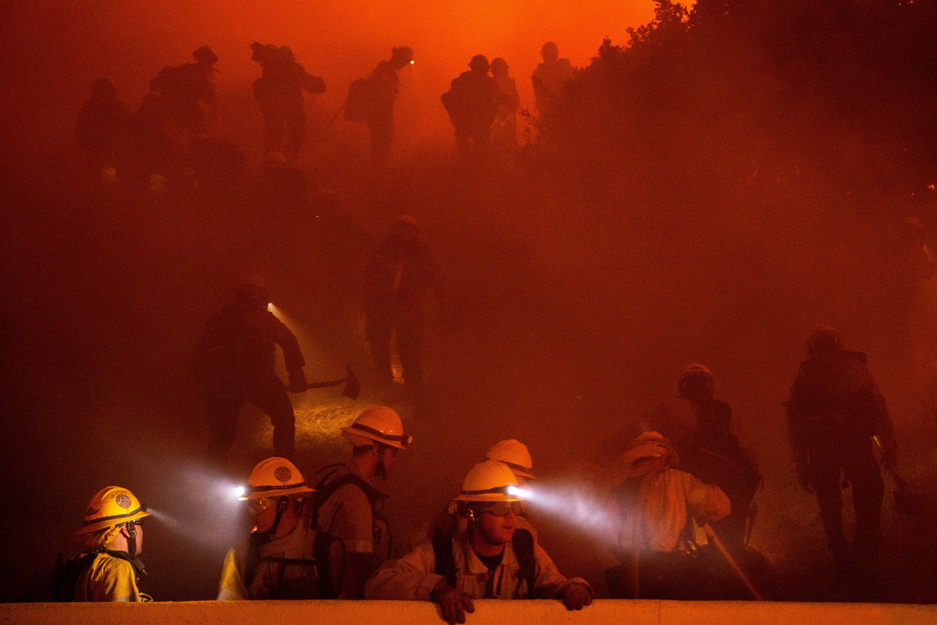 Firefighters battle the Franklin Fire on Tuesday in Malibu, California. The brush fire’s cause remains under investigation