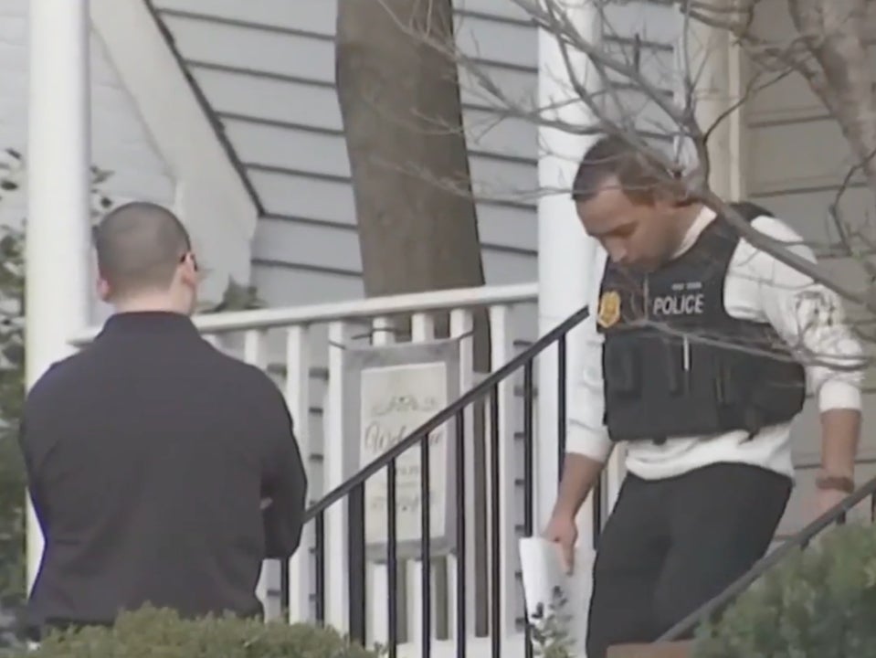 A police officer in Chevy Chase, Maryland exits the house where 37-year-old Mackenzie Colgan allegedly drowned her 3-month old daughter in a bathtub on December 8, 2024