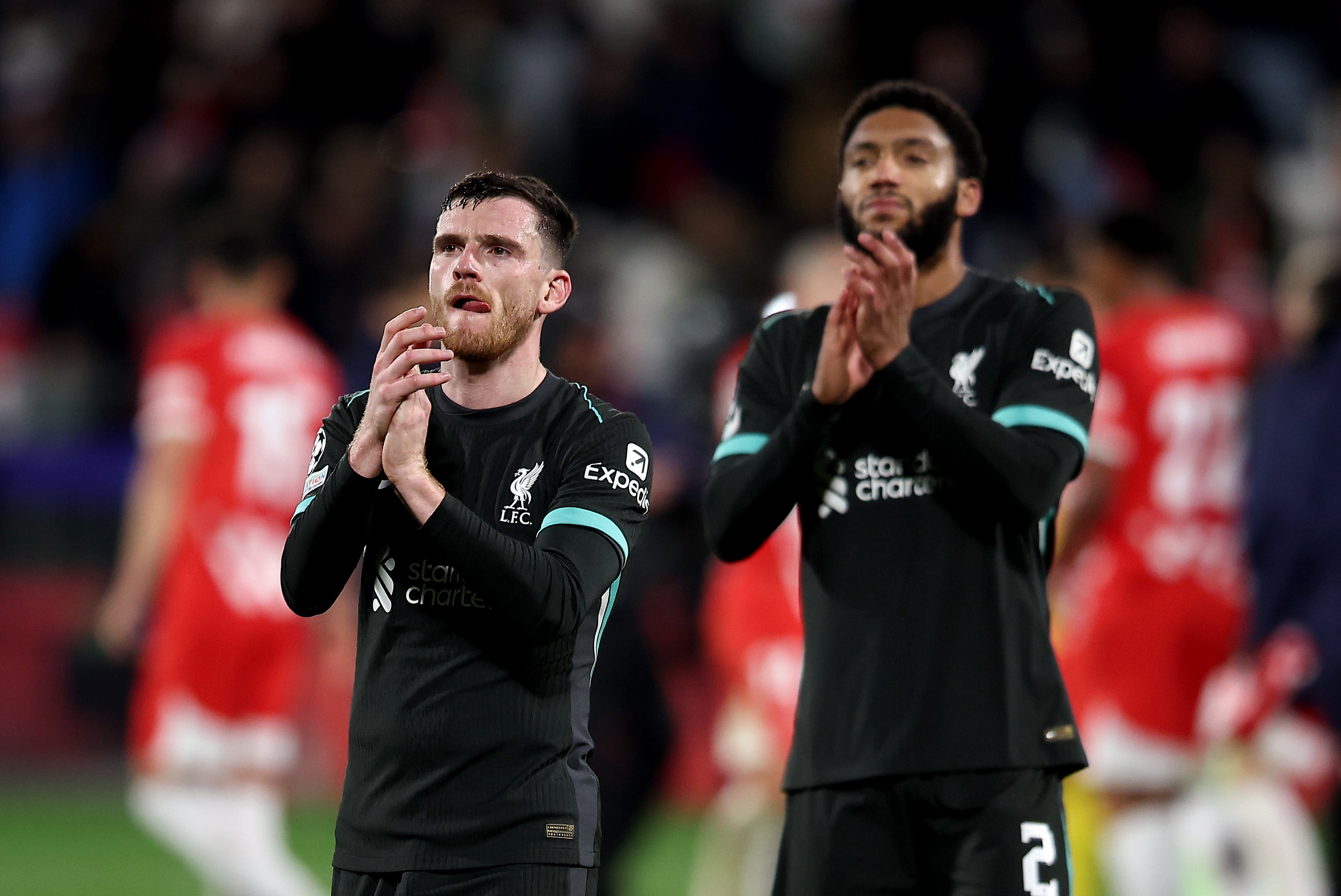 Andrew Robertson and Joe Gomez applaud the Liverpool fans after the game