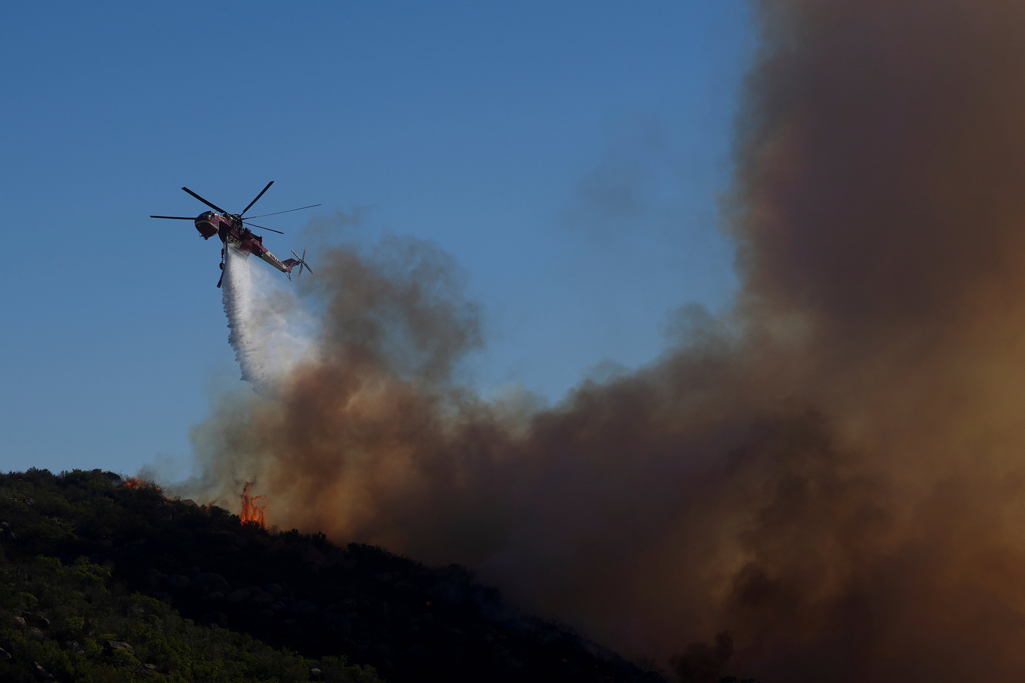 Water is dropped onto the Franklin Fire using a helicopter on Tuesday in Malibu, California. More than 800 personnel were responding to the blaze