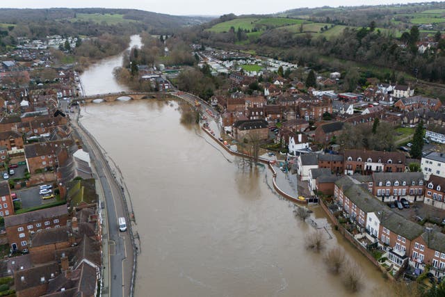 <p>A general view of the river Severn flooding streets in the town of Bewdley</p>