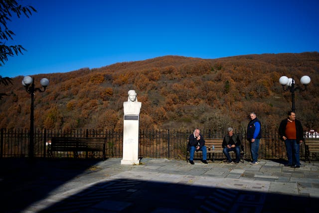 <p>Locals gather at the main square of Fourna village, central Greece</p>