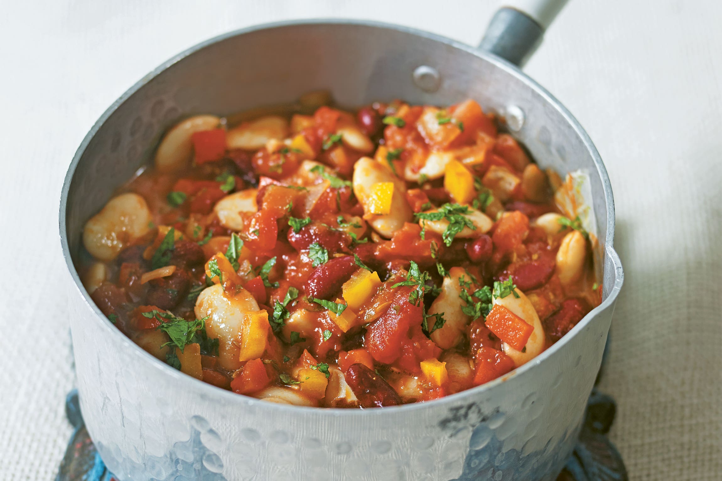 One of the veggie dishes in Dowden’s new book is beans and peppers with harissa