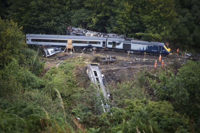 Three people died following the derailment (Jane Barlow/PA)