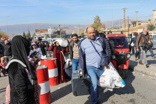 <p>Syrian and Lebanese people at the Al-Masnaa border crossing</p>