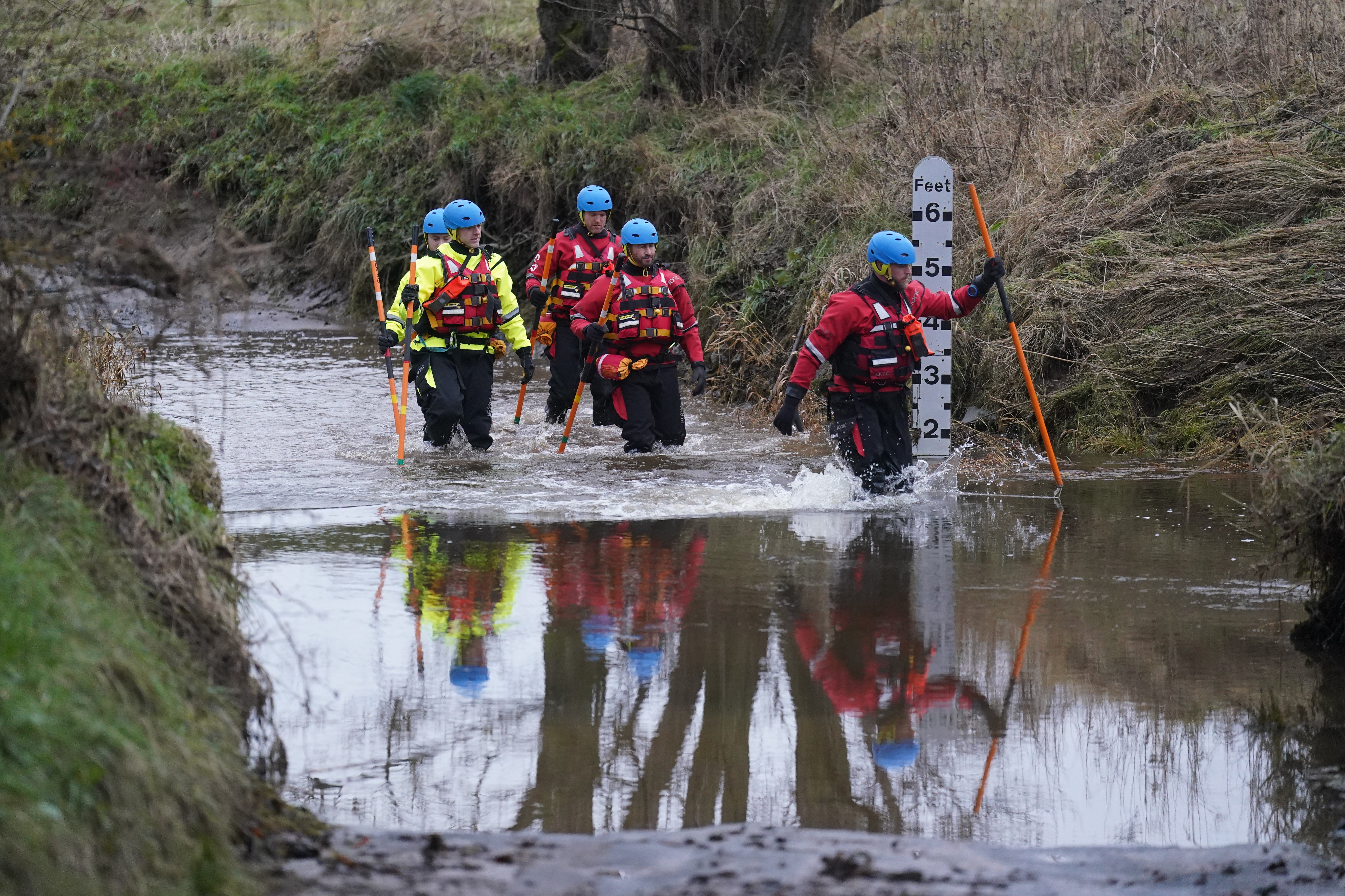 Members of a search and rescue team during a search operation at Abberwick Ford on the River Aln near Alnwick, Northumberland