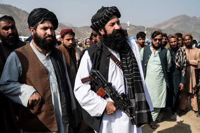 <p>Afghanistan’s minister for refugees, Khalil Haqqani, inspects a refugee camp near the Afghanistan-Pakistan Torkham border last month </p>