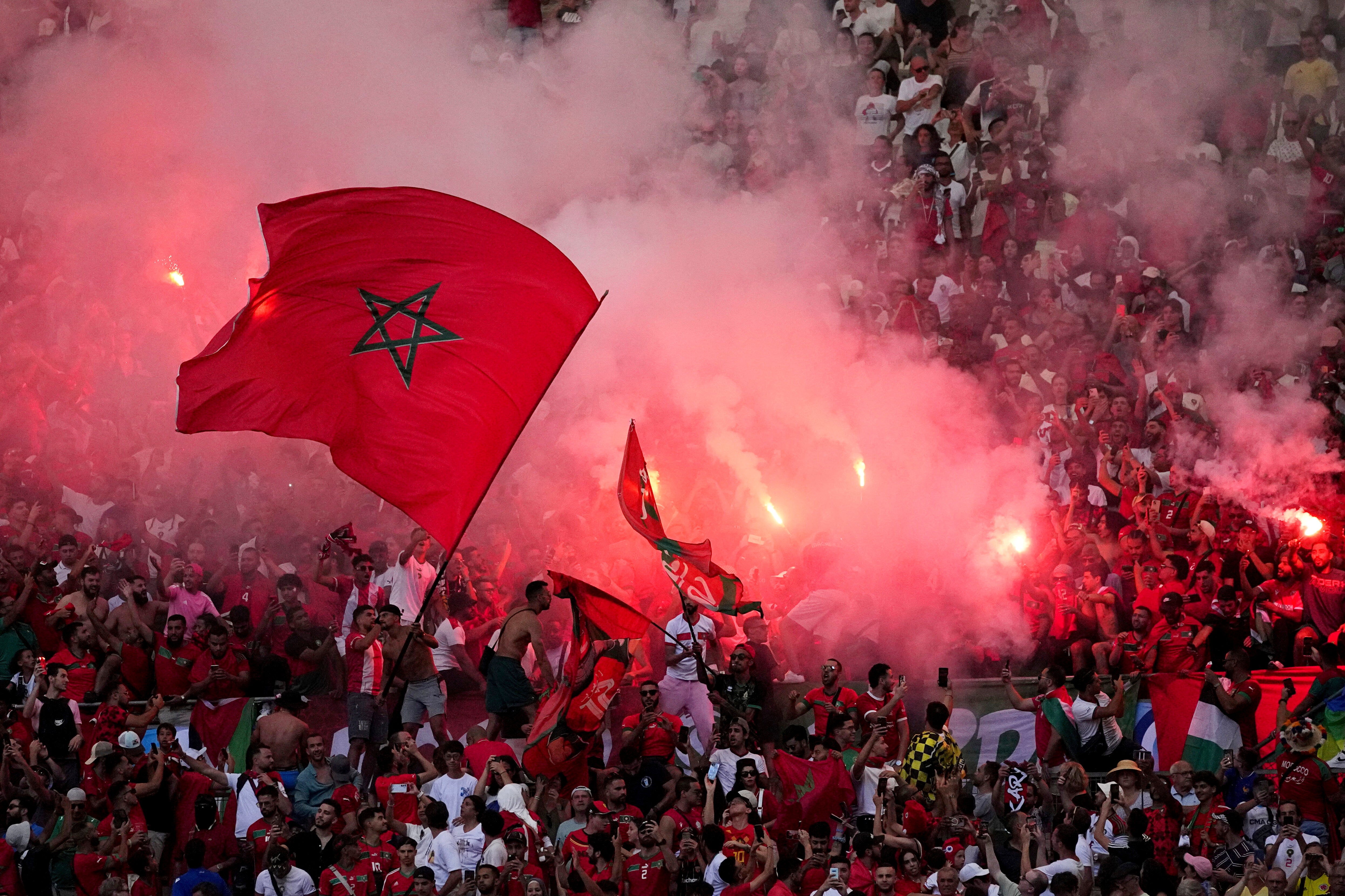 Morroco fans light flares during a men's semifinal soccer match between Morocco and Spain at the 2024 Summer Olympics, Monday, Aug. 5, 2024, at Marseille Stadium in Marseille, France. (AP Photo/Daniel Cole, File