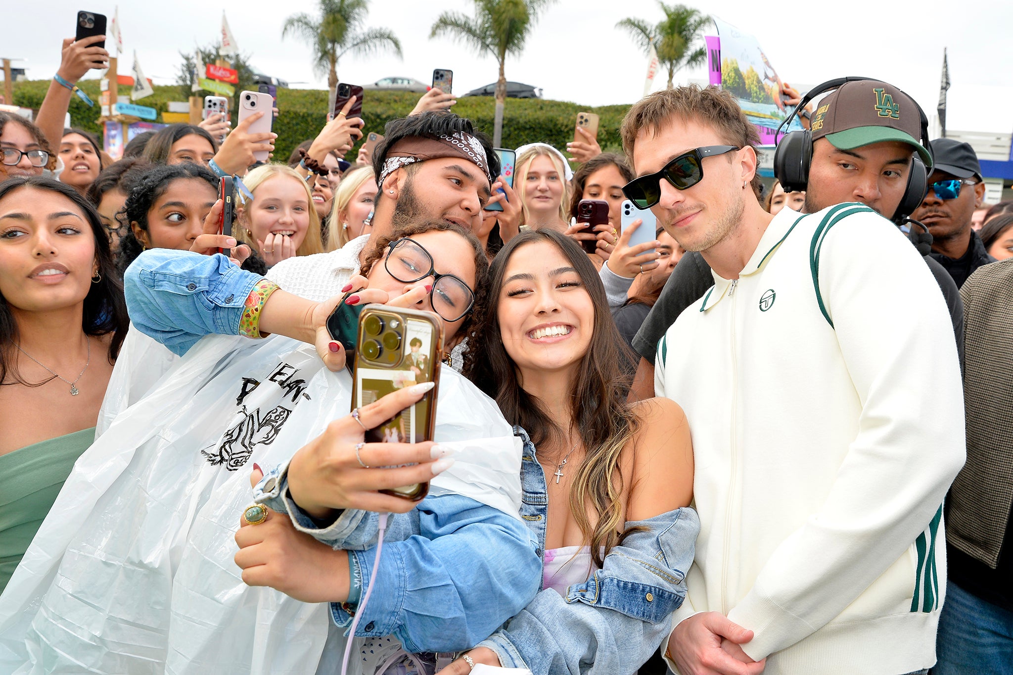 Modern fame: Starkey poses for fans at an ‘Outer Banks’ event in November