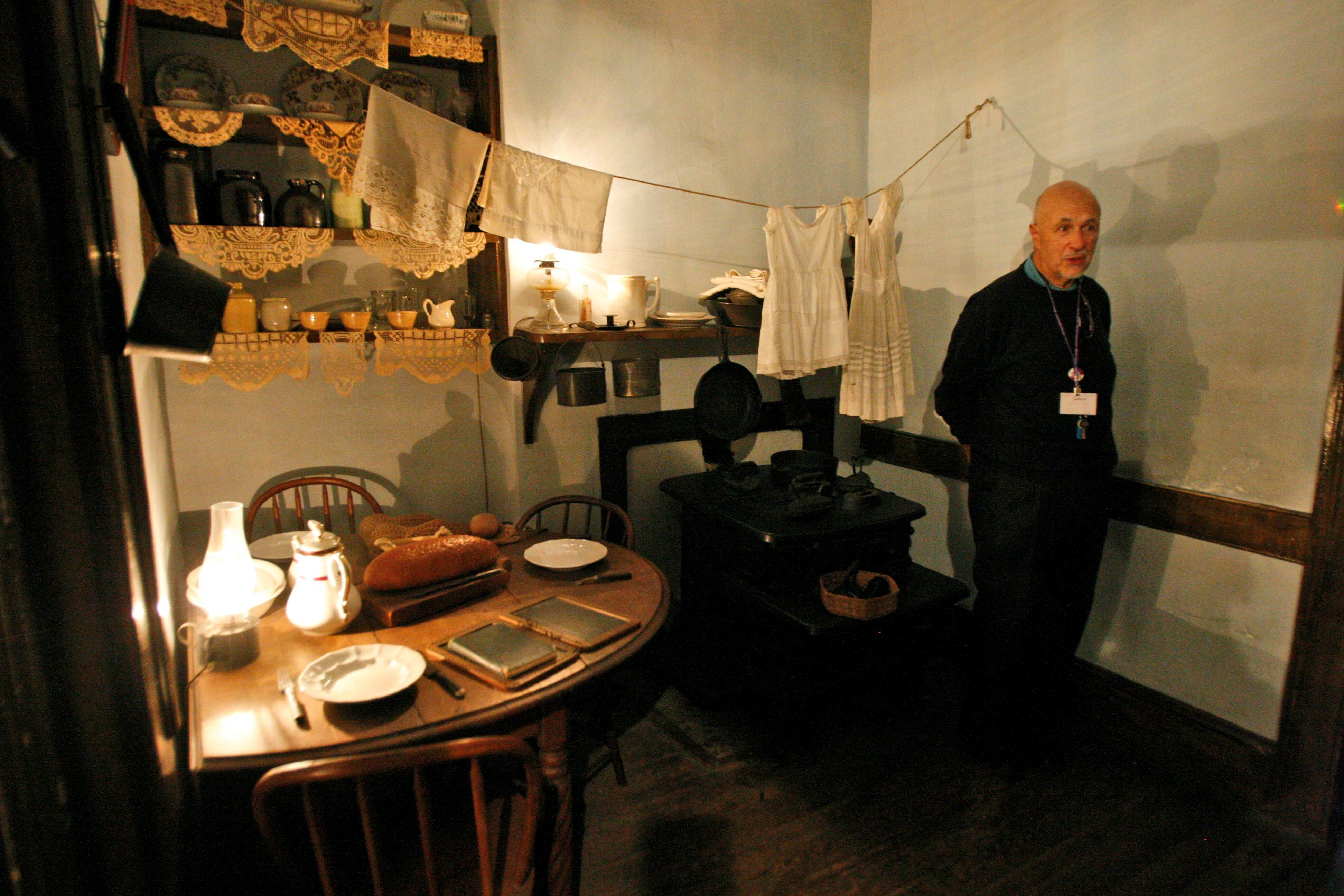 Guide Stephen Flicker speaks during a tour of an apartment inside the Tenement Museum on the Lower East Side