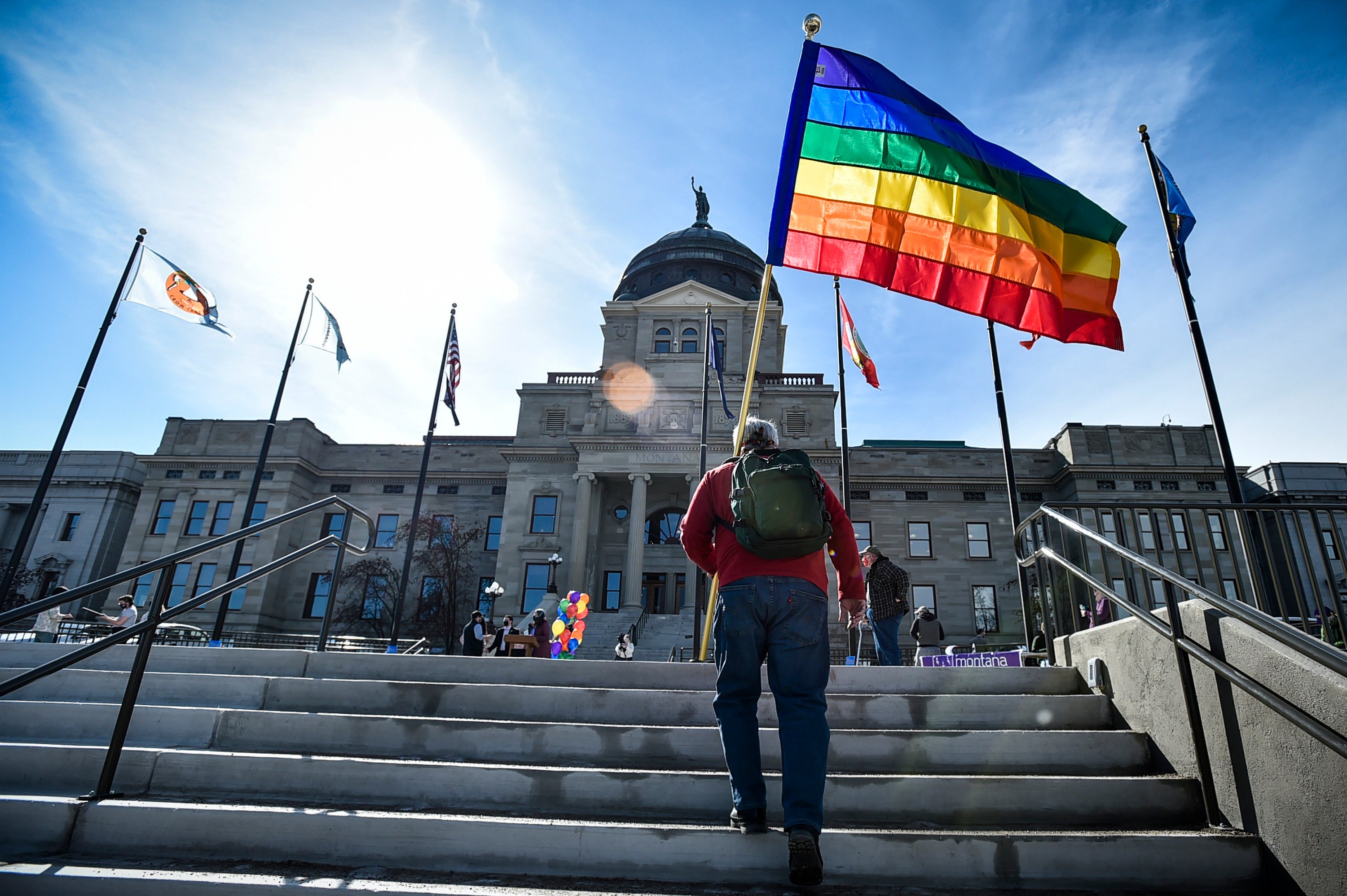 <p>Demonstrators gather on the steps of the Montana state Capitol in Helena protesting anti-LGBTQ+ legislation. </p>