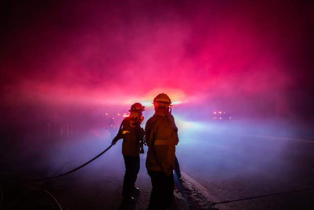 <p>A Firefighter fights the Franklin Fire on Wednesday morning near Malibu, California. The blaze, fanned by the Santa Ana winds, has spread over 4,000 acres</p>